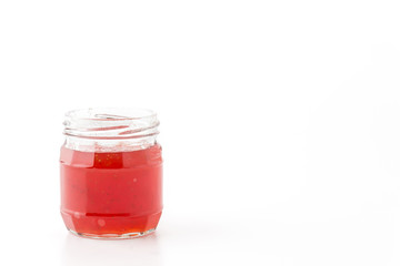 strawberry jam bottle on white background