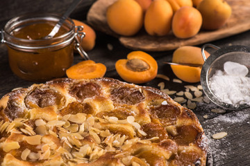 Homemade apricot tart with almonds and fresh fruits