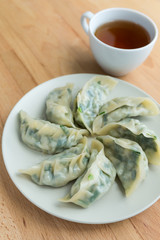 Chinese meat dumpling with a cup of tea