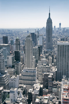 View of Midtown Manhattan New York City skyline on bright summer afternoon