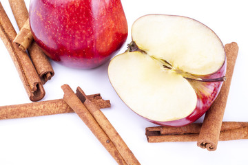 Apple and cinnamon shot from front on on a wooden background at an angle
