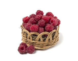 Fototapeta na wymiar Raspberry in a wicker basket. Isolated on white background