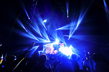 Fototapeta na wymiar night club festival crowd with people silhouettes 