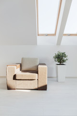 Contrastive armchair in the attic