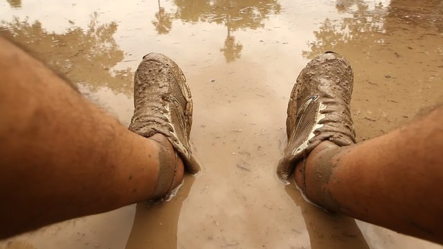 Male Legs in the Mud water