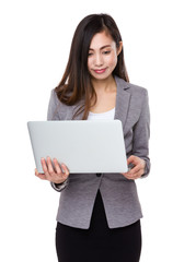 Fototapeta premium Young businesswoman use of the laptop computer