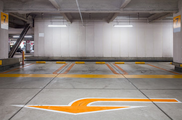 Empty space car park interior at night