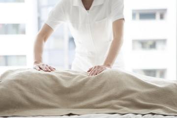Fototapeta premium Manipulative nurses that have a back massage