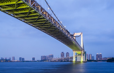 Fototapeta premium Tokyo bay city and Tokyo rainbow bridge in evening