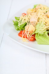 Caesar salad in a white plate