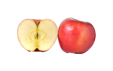 whole and half cut red apples with stem on white background