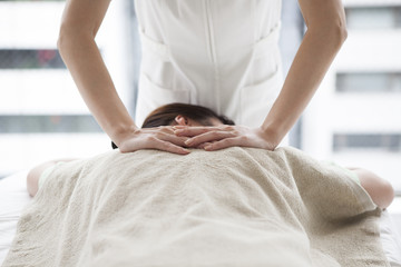 Women receiving back massage