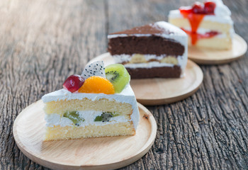 friuts cake on wood plate on wood background