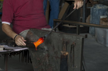 Glasswork artisan make glass horse in Murano island, Italy  