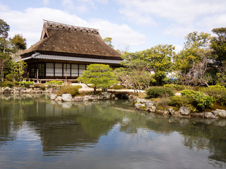 Fototapeta na wymiar Tea house and pond in Isuien garden, Nara