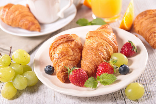 breakfast with coffee,croissant and fruits