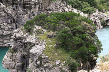 mountain landscape with mountain turbulent river in the gorge