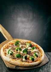 Tasty broccoli and mushroom pizza