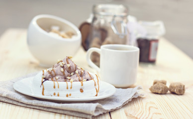 White meringues with brown chocolate stripes