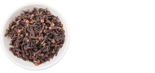 Clove spices in white bowl over white background