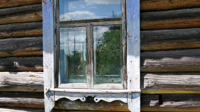 Window with traditional carving in Russian village wooden house