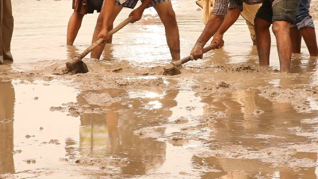 People preparing for Mud Bathing Nature Field Spa India