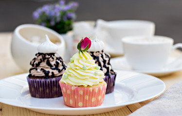 Chocolate Cupcake with chocolate frosting on the table