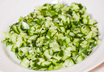 Green vegetable salad of cucumbers, spring onion