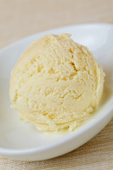 Fototapeta na wymiar Scoop of homemade vanilla ice cream