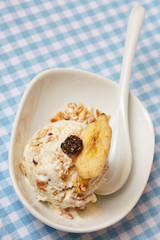 Granola ice cream with cereal and spoon