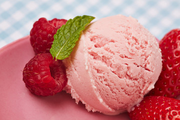 Scoop of strawberry ice cream with peppermint