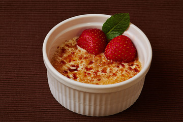 Creme Brulee with ice cream and strawberries