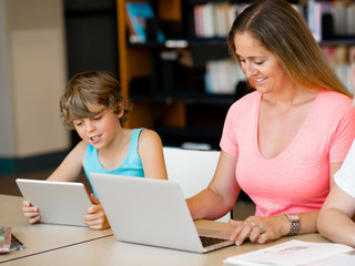 Mother with kids in library