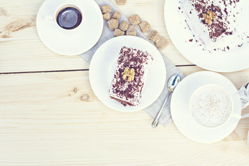 Obraz na płótnie Canvas Delicious chocolate cake on plate on table on light background. Tonned photo.