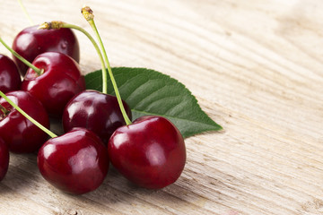 Cherries on wooden table