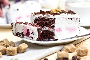 Delicious chocolate cake on plate on table on light background
