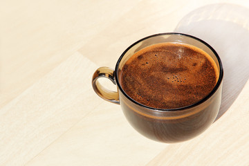 Coffee mug taken closeup on beige background.