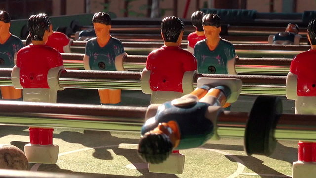 Table Soccer, Blue and Red Players in Football Kicker Game, Selective Focus, Retro Cinematic Tone Effect