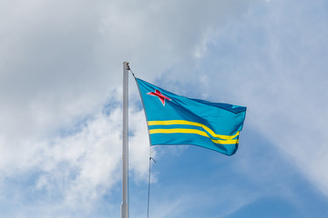 Flag of Aruba Under Clouds