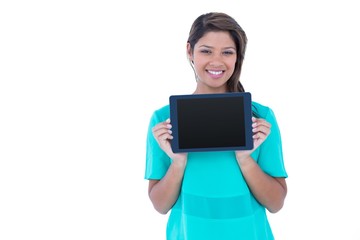 Pretty brunette showing tablet computer 