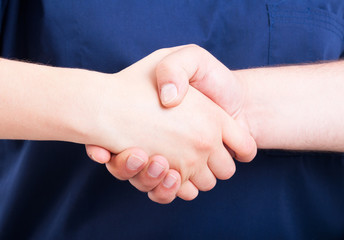 Male and female hand shaking