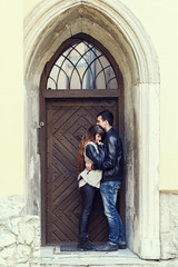 Fototapeta na wymiar wooden door retro couple hugging