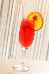 red cocktail with orange