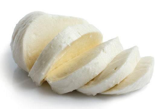 Single ball of mozzarella cheese sliced and isolated on white.