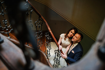 Just married in the wooden stairs of an ancient building