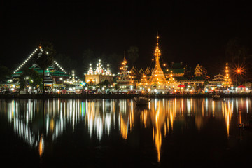 Fototapeta na wymiar Wat Jong Klang in dark night and reflection at Maehongson,province North of Thailand