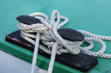 Fototapeta premium Knots and ropes on a moored ship in harbor