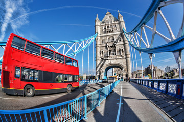 Famous Tower Bridge with red bus in London, England