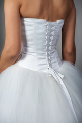 Closeup shot of a bridal gown with corset, back view
