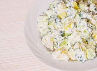 Potato salad with green onions and cucumber
